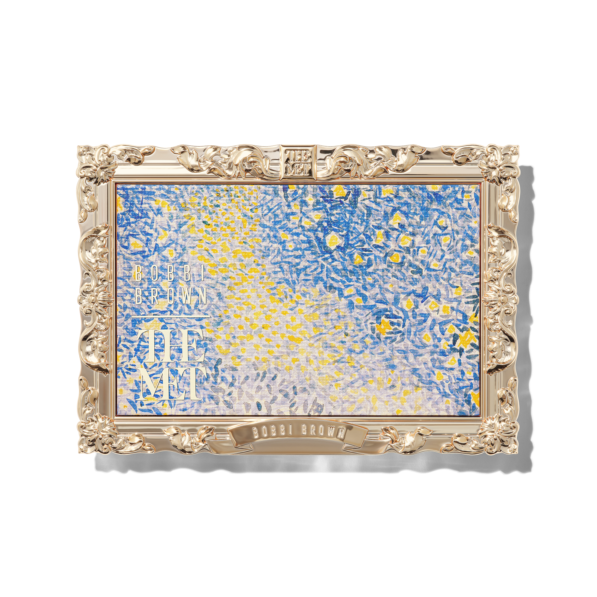 Closed Bobbi Brown x The Met eyeshadow palette with an ornate gold frame around a detail from Landscape with Stars.