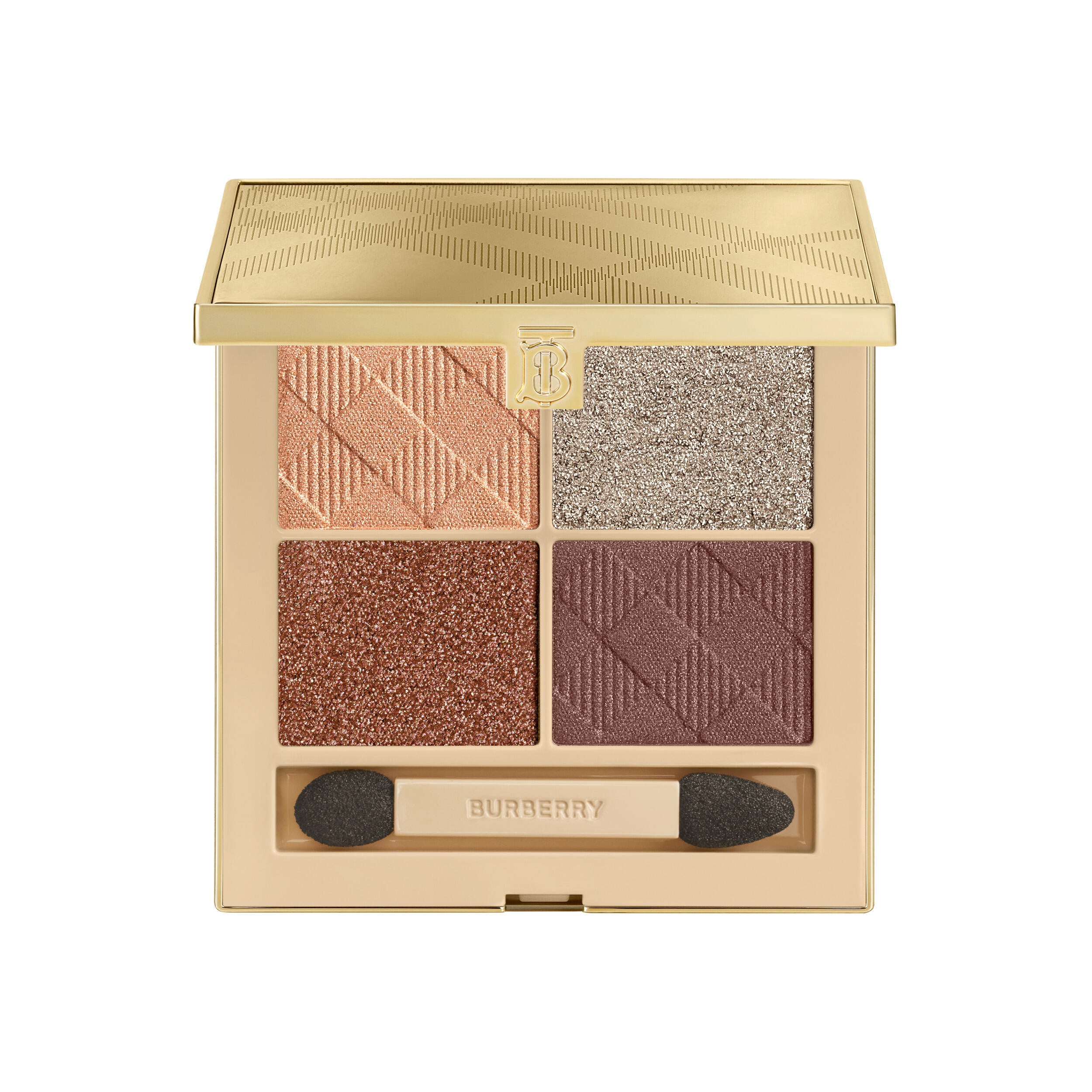 Open gold Burberry Winter Gold eye palette with champagne-peach, silver, bronze and deep brown pans above a double-ended sponge applicator.