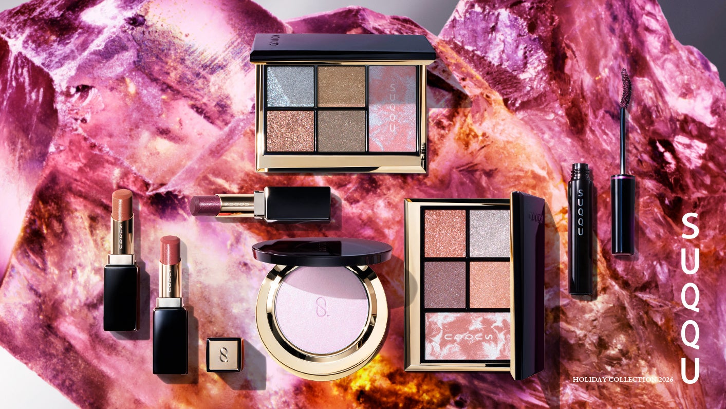 SUQQU Frozen Light eye and face palettes, lipsticks, powder and purple mascara against luminous pink gemstone formations.